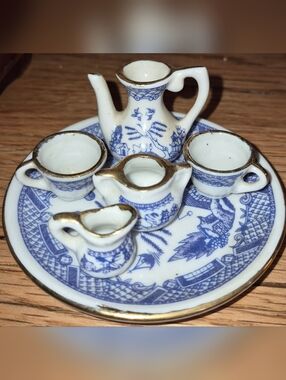 Vintage Blue Willow miniature porcelain tea set with gold rimmed details